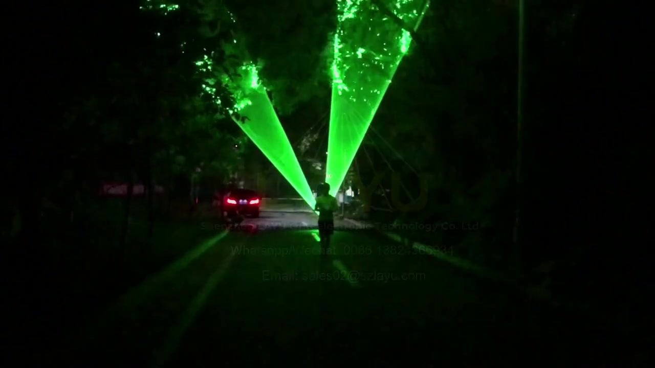 Green laser light outdoor performance in a park